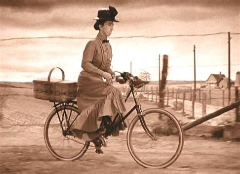 Wicked witch of the west riding bycicle